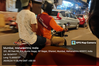 GPS map camera image of two people riding a motorbike in Mumbai